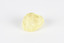 A small solid crystalline mineral specimen that is largely light yellow, with some darkening near top. 