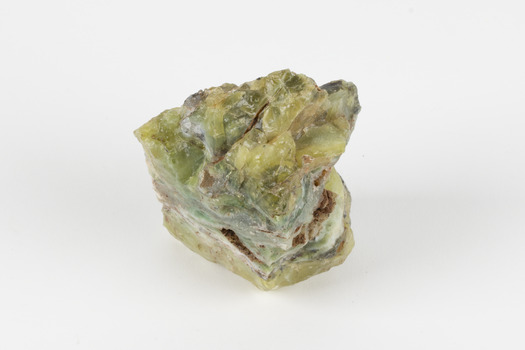 A solid mineral specimen in shades of yellow and gray-green. 