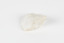A hand-sized solid rock specimen in shades of white 