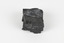 A hand-sized solid black-coloured specimen with jagged edges.