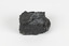 A hand-sized solid black-coloured specimen with jagged edges.