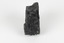 A hand-sized solid black-coloured specimen with jagged edges.