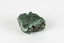 A palm-sized solid mineral specimen with a rough, uneven surface and a variety of green colourations. 