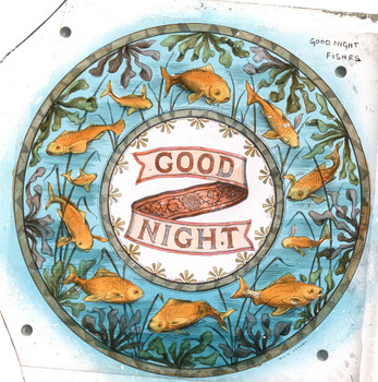 A monochrome photograph that has been hand-painted featuring a circular image of swimming goldfish surrounding the words 'Good Night'