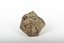 A small textured caramel-coloured rock with brown marbling in the shape of a hexagon. Two deep-brown patches visible on the top left.