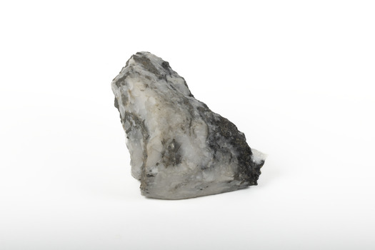 Solid mineral specimen in shades of grey, white and black
