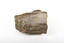 A solid mineral in shades of brown, white, and beige