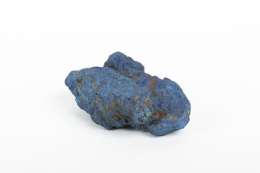 A solid mineral specimen in shades of blue 