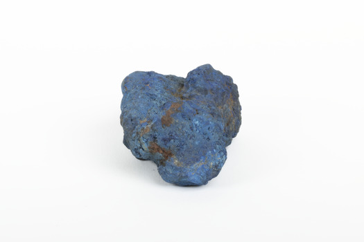 A solid mineral specimen in shades of blue 