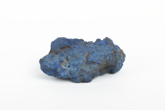 A solid mineral specimen in shades of blue 