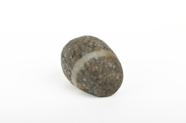 A solid rock specimen with a mineral vein in shades of brown 