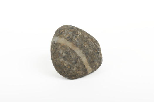 A solid rock specimen with a mineral vein in shades of brown 