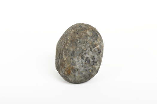 A solid rock specimen with a mineral vein in shades of brown 