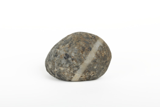 A solid rock specimen with a mineral vein in shades of brown 