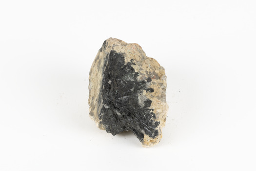 A hand-sized solid mineral specimen in shades of brown, green, light grey and dark grey