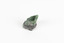 A small solid mineral specimen that is primarily pale green and blue-grey with speckles of beige and white.