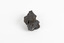 A small solid mineral specimen that is blue-grey in colour with rust brown specks throughout.