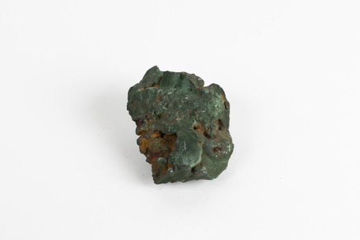 A hand-sized solid mineral specimen in shades of blue, green and copper.