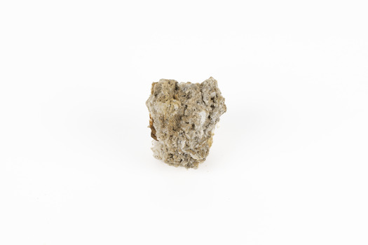 A small lead carbon specimen in shades of white, cream and brown. 