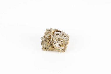 A small lead carbon specimen in shades of white, cream and brown. 