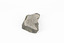 Coin-sized solid mineral with tiny crystals and shades of black and beige.