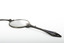 A pair of spectacles with a decorative handle attached.