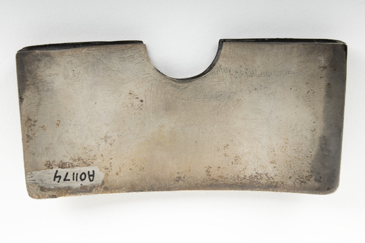 The back of a rectangular silver card case.
