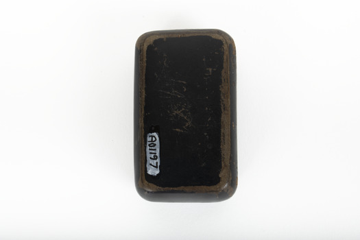 The bottom of a small black rectangular box