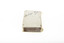 A small white rectangular box with cursive writing on top.