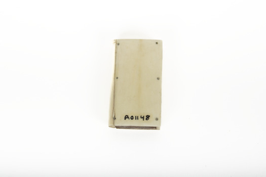 The bottom of a small white rectangular box.