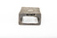 A silver rectangular match case with an embossed top.