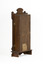 Obverse side view of a deep brown wooden striking mantle clock showing two small golden door hinges.