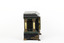 Side view of a Seth Thomas black mantle clock with green marbling detail. The clock also features ornate gold claw feet and fine gold painted detailing. From this angle, the front and rear white pillars are visible.
