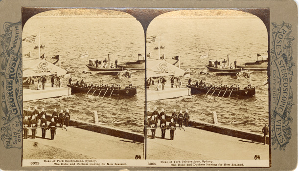 Two sepia toned photos of three boats on the water next to a floating dock/pontoon with land in the foreground. Two lines of officials stand on a road in the foreground, one boat in the centre of the image has a flag at each end, four oars visible and 15-17 people seated in it. The pontoon has a roof with official regalia including the British flag. The other boats in the background are smaller with only two people clearly visible.