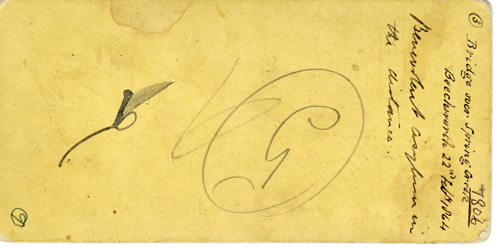 Worn yellow paper with staining and some cursive handwriting.