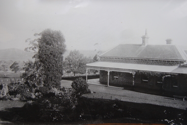 View of bluestone homestead and surrounding garden. 