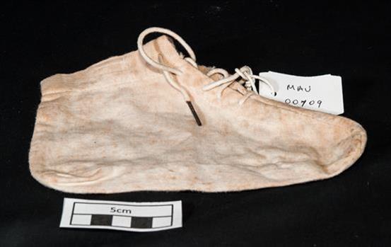 A calico infants bootee with laces