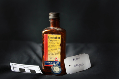Manufactured Glass, brown bottle 'Campholine', c1950