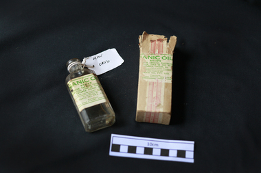 Manufactured Glass, bottle 'Sanic Oil' with box, 20thC