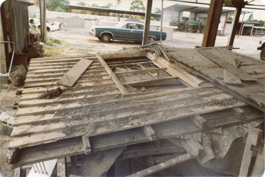 'Box Cottage' dismantled in sections, lying on the floor of the storage building of the Lewis Timber Co Ltd Jasper Road Ormond (1 of 3)