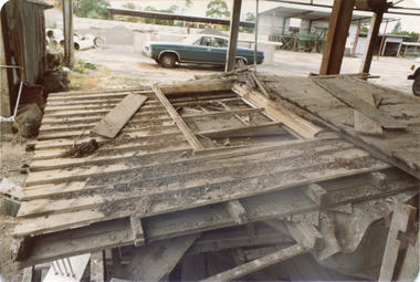 'Box Cottage' dismantled in sections, lying on the floor of the storage building of the Lewis Timber Co Ltd Jasper Road Ormond (1 of 3)
