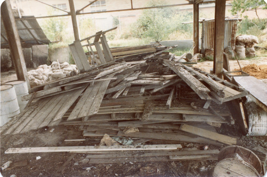 'Box Cottage' dismantled in sections, lying on the floor of the storage building of the Lewis Timber Co Ltd Jasper Road Ormond (3 of 3)