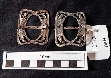 Manufactured Object,  2 x oval  metal  filigree buckles