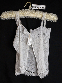 Clothing, lady's white lacework camisole , ribbon