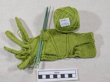 Craftwork, knitting green cotton glove , needles, c1950