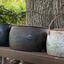 Set of 3 cast iron cooking pots, L-R 9 gallons, 7 gallons and 5 gallons
