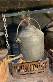 Clark's cast iron kettle with brass tap.