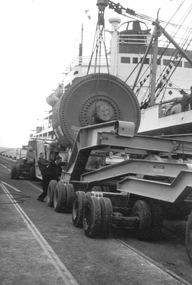 Photograph, Vessel 'Ixion' berthed to discharge a heavy lift for APML (Australian Paper Manufacturers), October 1959, 1959