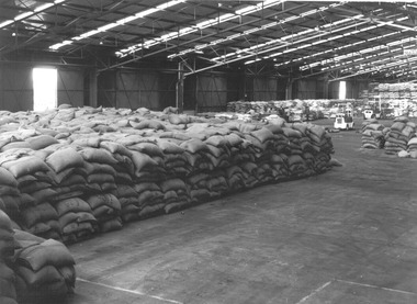 Photograph, Bagged goods in shed, n.d