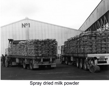Photograph - Photograph - unloading bagged goods being brought to port on back of trucks, n.d
